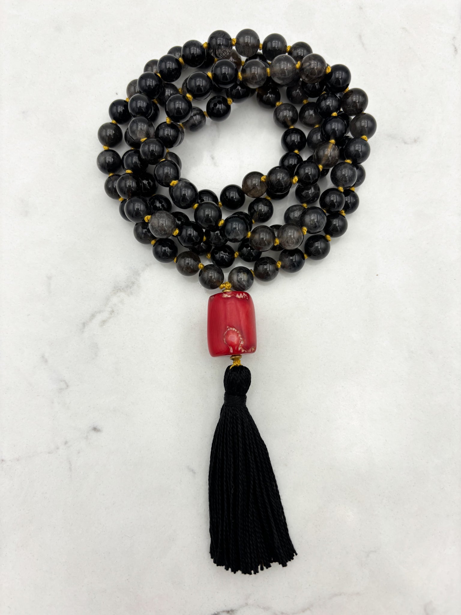 black rutile quartz gemstone mala necklace with red coral guru bead and black tassel | radiant malas | handmade in boulder, colorado