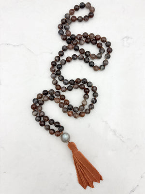 black sunstone gemstone mala with labradorite guru bead and rust colored silk tassel | radiant malas | handmade in boulder, colorado