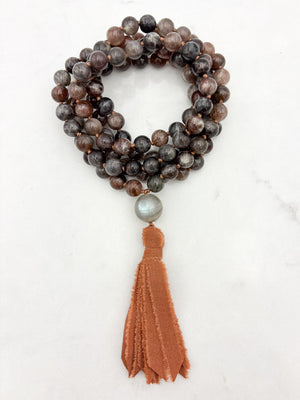 black sunstone gemstone mala with labradorite guru bead and rust colored silk tassel | radiant malas | handmade in boulder, colorado