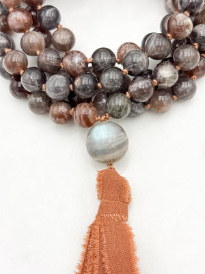 black sunstone gemstone mala with labradorite guru bead and rust colored silk tassel | radiant malas | handmade in boulder, colorado