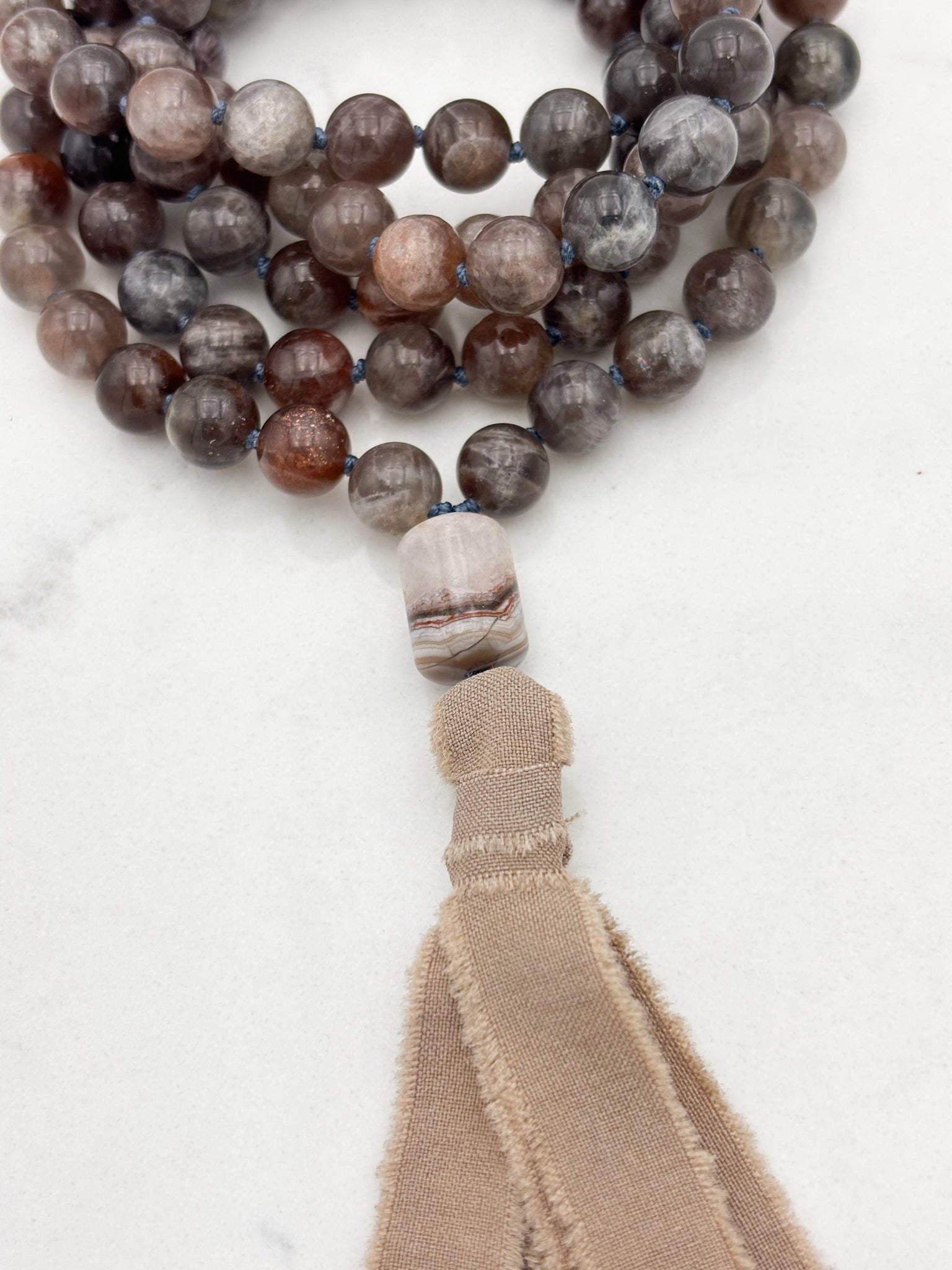 black sunstone gemstone mala necklace with rainbow amethyst guru bead and tan silk tassel |  radiant malas | handmade in boulder, colorado
