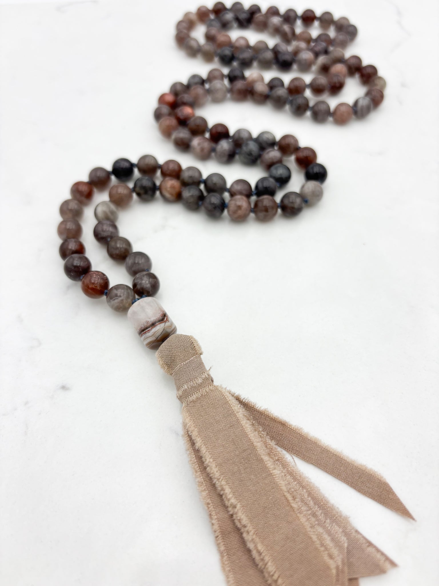 black sunstone gemstone mala necklace with rainbow amethyst guru bead and tan silk tassel |  radiant malas | handmade in boulder, colorado