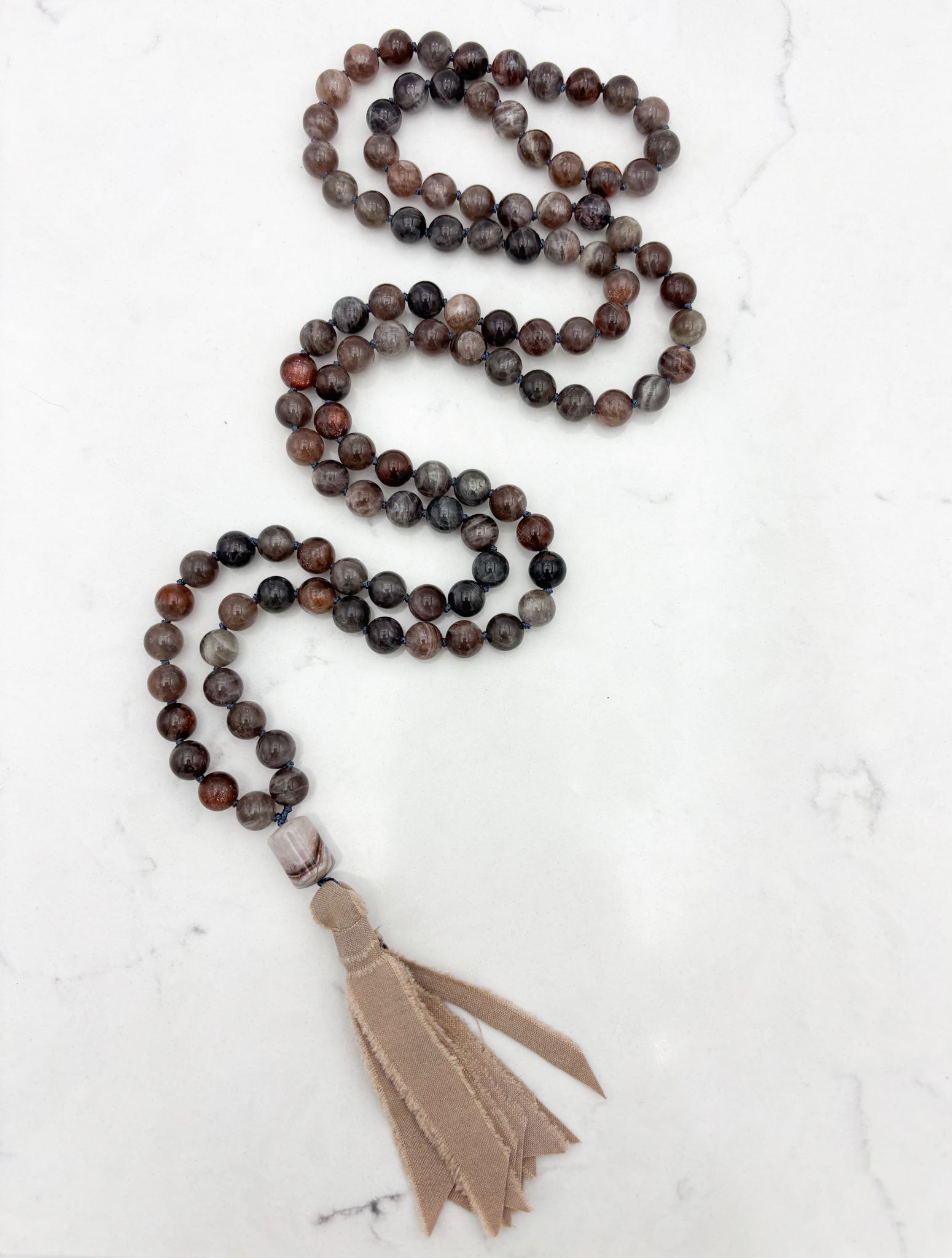 black sunstone gemstone mala necklace with rainbow amethyst guru bead and tan silk tassel |  radiant malas | handmade in boulder, colorado