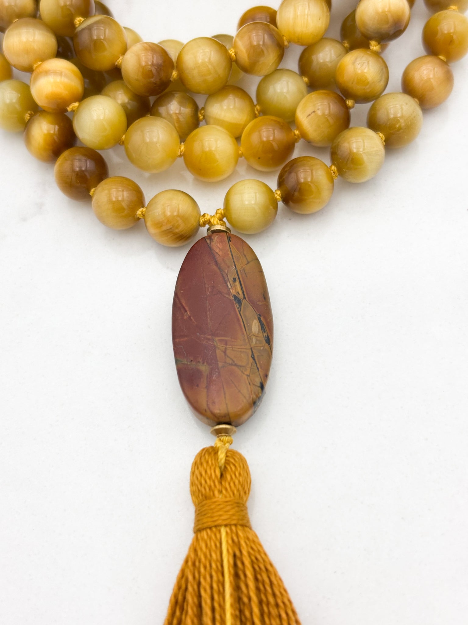 blond tiger's eye gemstone mala with jasper guru bead and gold tassel necklace | radiant malas | handmade in boulder, colorado