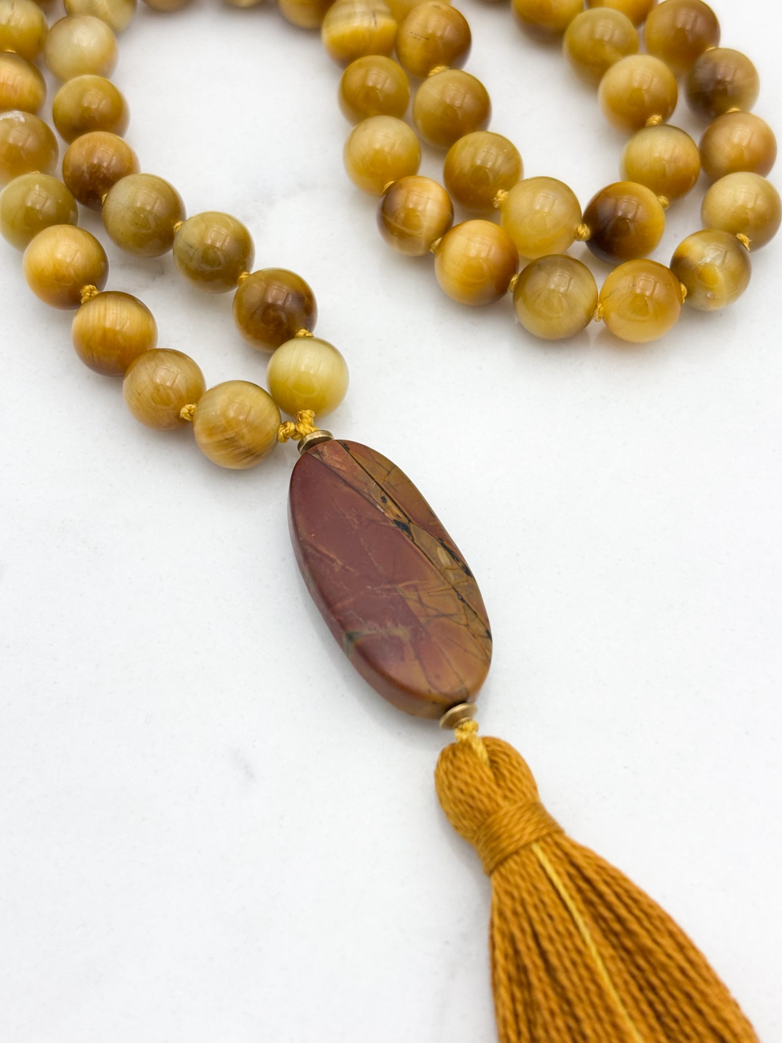 blond tiger's eye gemstone mala with jasper guru bead and gold tassel necklace | radiant malas | handmade in boulder, colorado