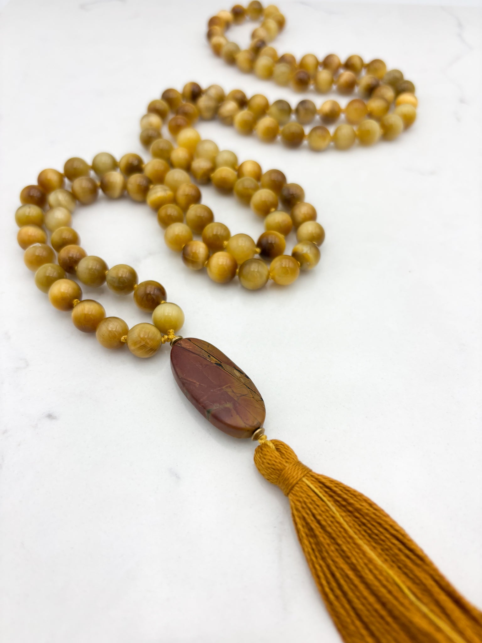 blond tiger's eye gemstone mala with jasper guru bead and gold tassel necklace | radiant malas | handmade in boulder, colorado