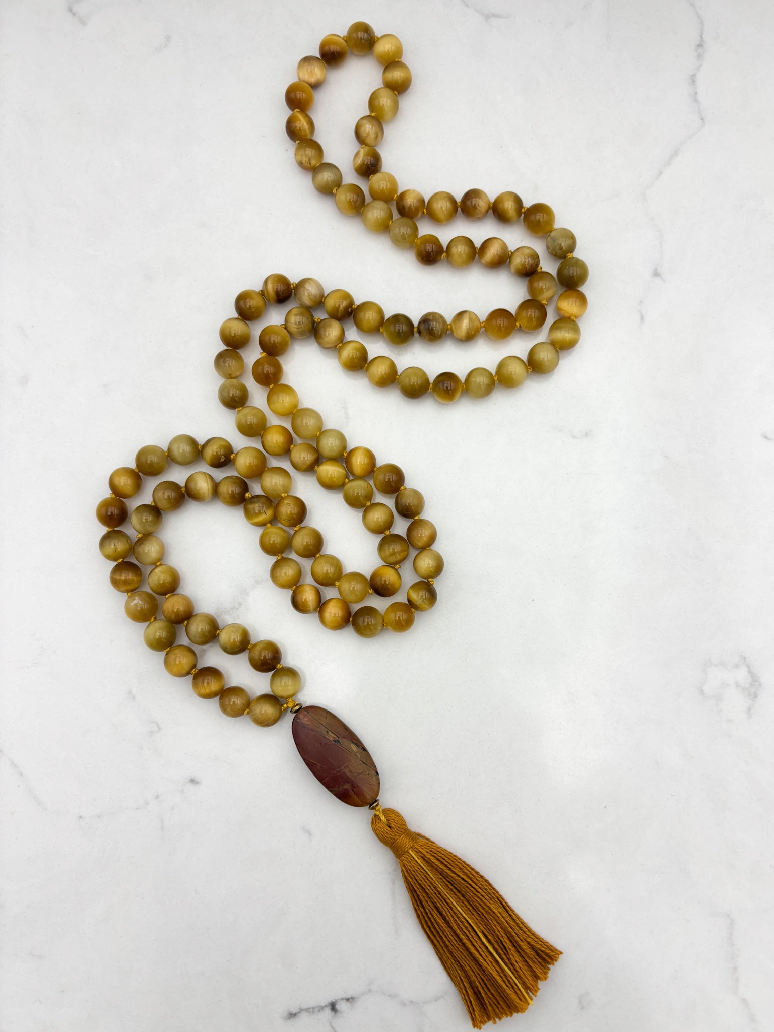 blond tiger's eye gemstone mala with jasper guru bead and gold tassel necklace | radiant malas | handmade in boulder, colorado