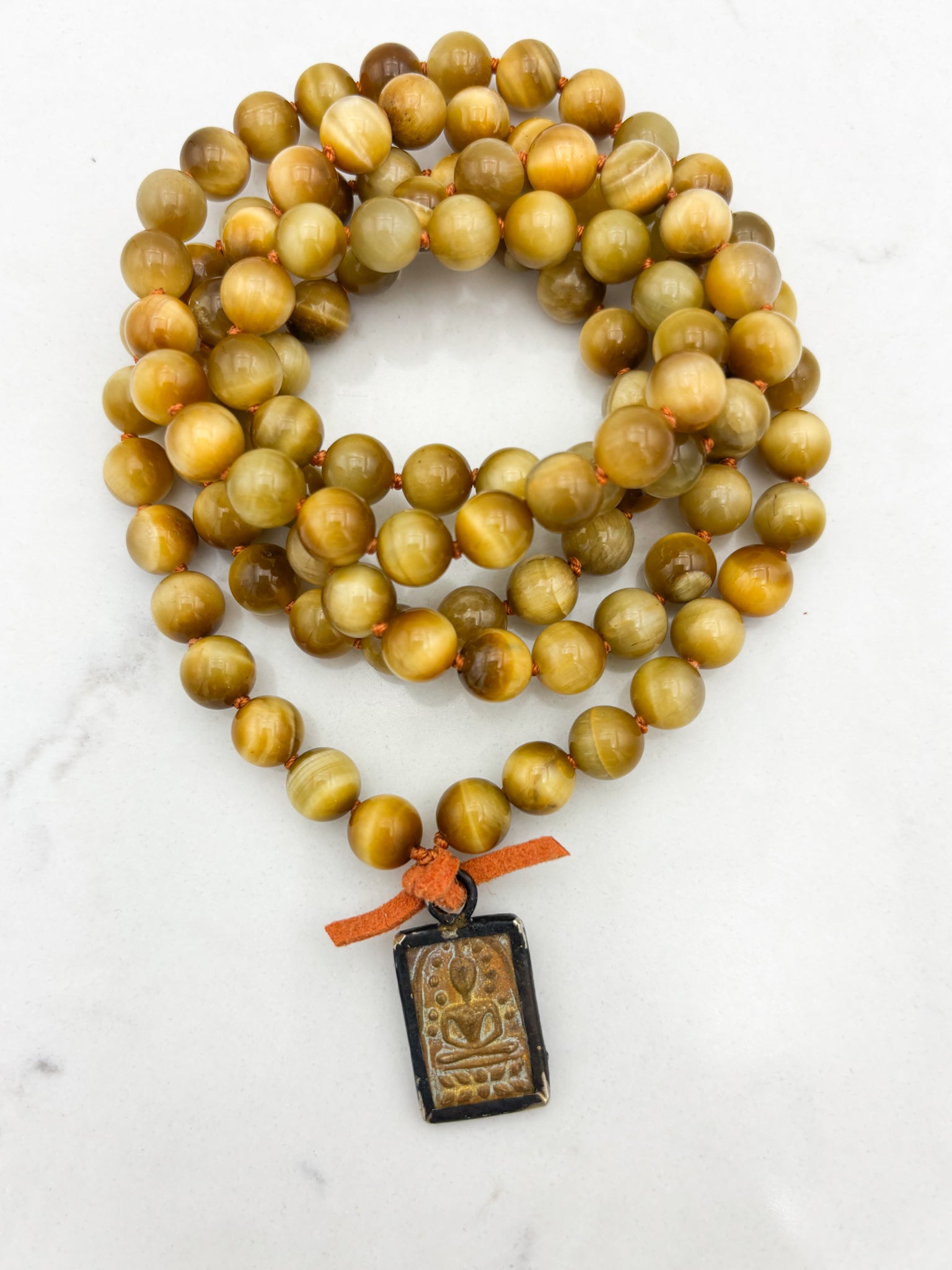 blond tiger's eye gemstone mala necklace with vintage brass pendant | radiant malas | handmade in boulder, colorado