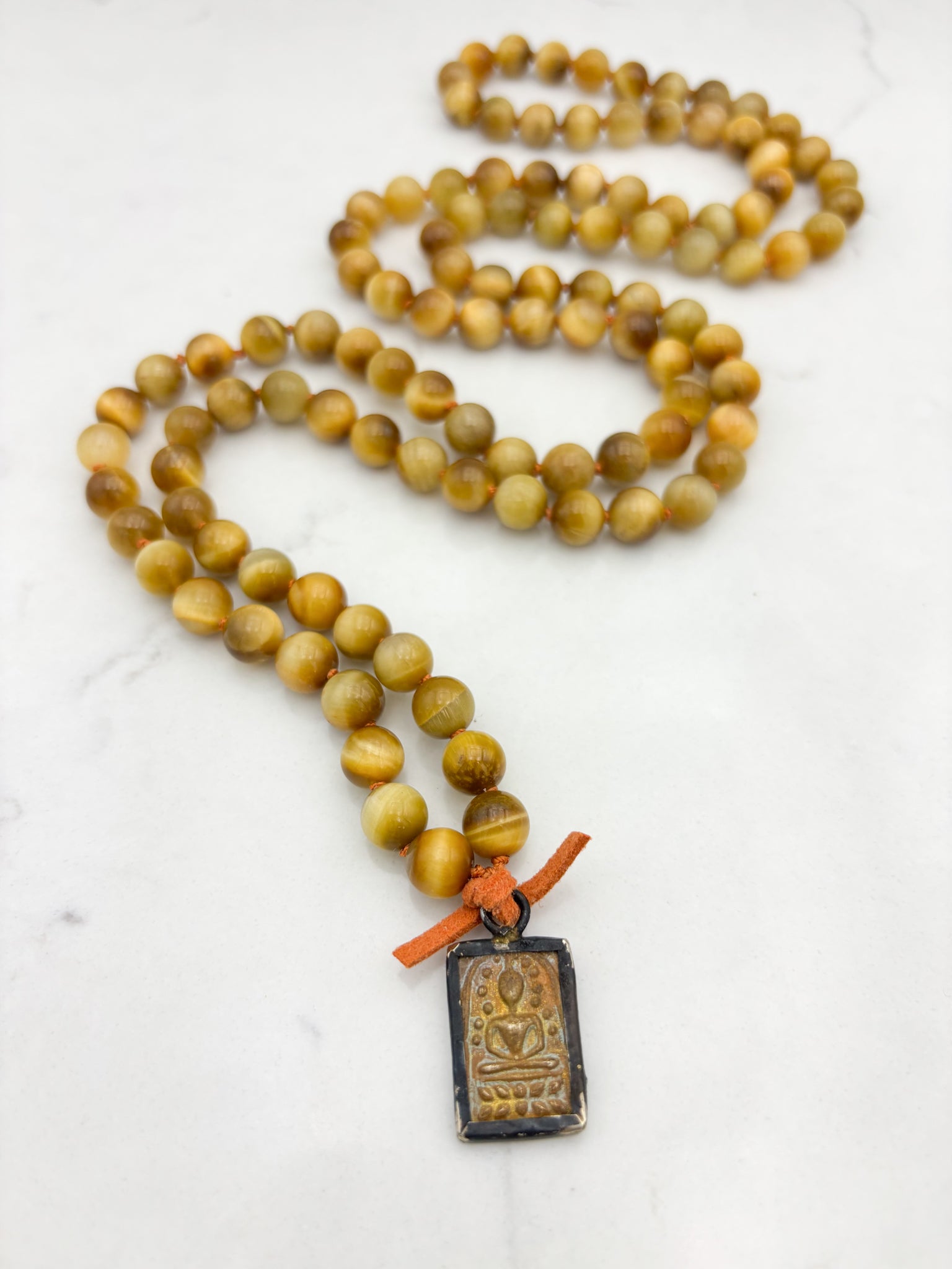 blond tiger's eye gemstone mala necklace with vintage brass pendant | radiant malas | handmade in boulder, colorado