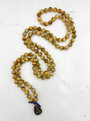 blond tiger's eye gemstone mala necklace with vintage brass pendant | radiant malas | handmade in boulder, colorado