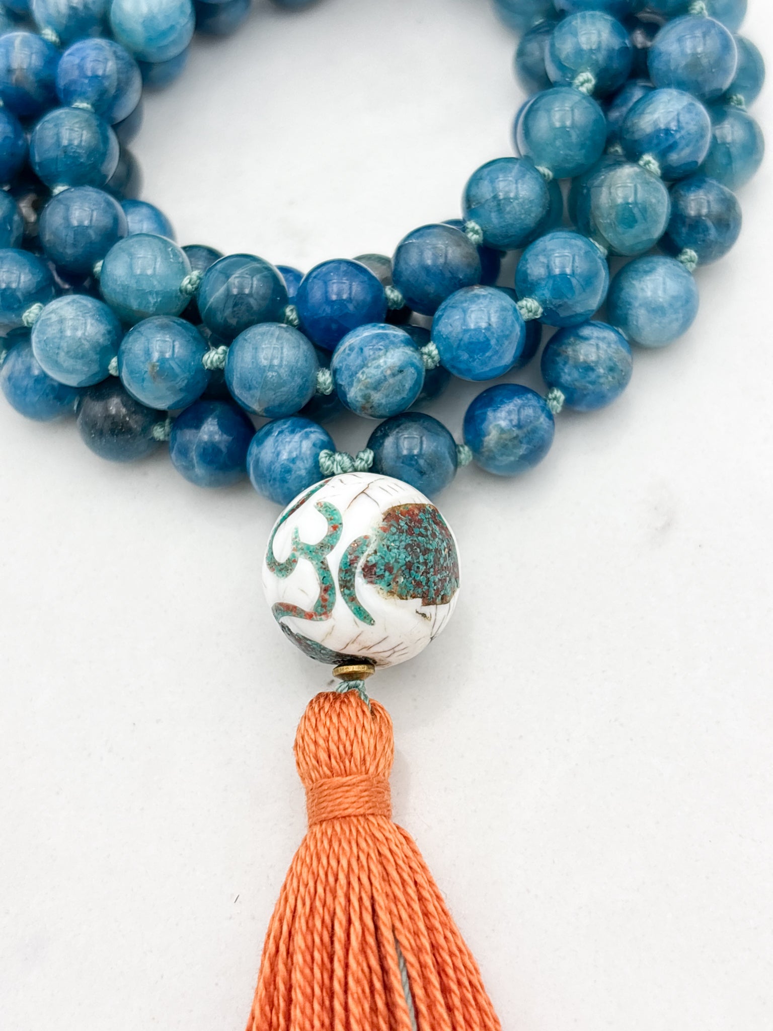 blue apatite gemstone mala with bone turquoise coral guru bead and orange | radiant malas | handmade in boulder, colorado