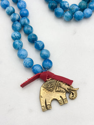 blue apatite gemstone mala with brass elephant pendant | radiant malas | handmade in boulder, colorado