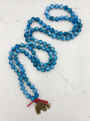 blue apatite gemstone mala with brass elephant pendant | radiant malas | handmade in boulder, colorado