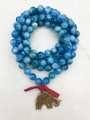 blue apatite gemstone mala with brass elephant pendant | radiant malas | handmade in boulder, colorado