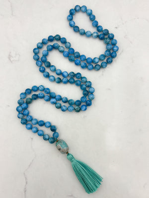 blue apatite gemstone mala with ceramic guru bead and teal tassel | radiant malas | handmade in boulder, colorado