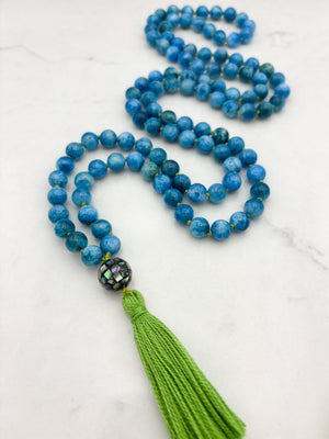 blue apatite gemstone mala with mosaic abalone shell guru bead and green tassel | radiant malas | handmade in boulder, colorado