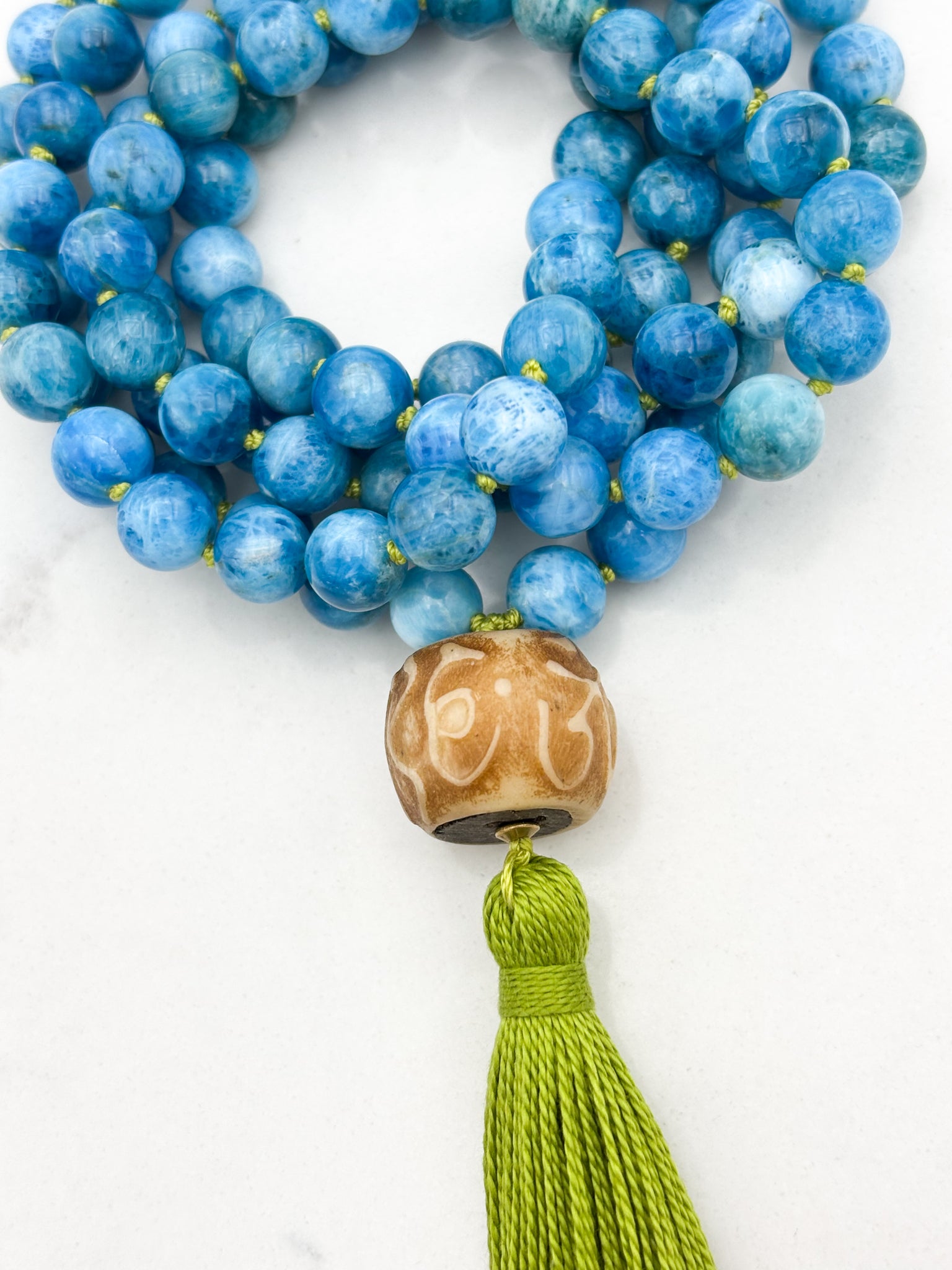 Blue Apatite gemstone mala with carved bone guru bead and green tassel | radiant malas | handmade in boulder, colorado