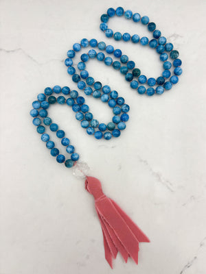 blue apatite gemstone mala with lotus-carved clear quartz guru bead and pinnk silk tassel | radiant malas | handmade in boulder, colorado