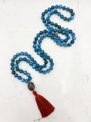 blue apatite gemstone mala necklace with Tibetan guru bead and rust tassel | radiant malas | handmade in boulder, colorado
