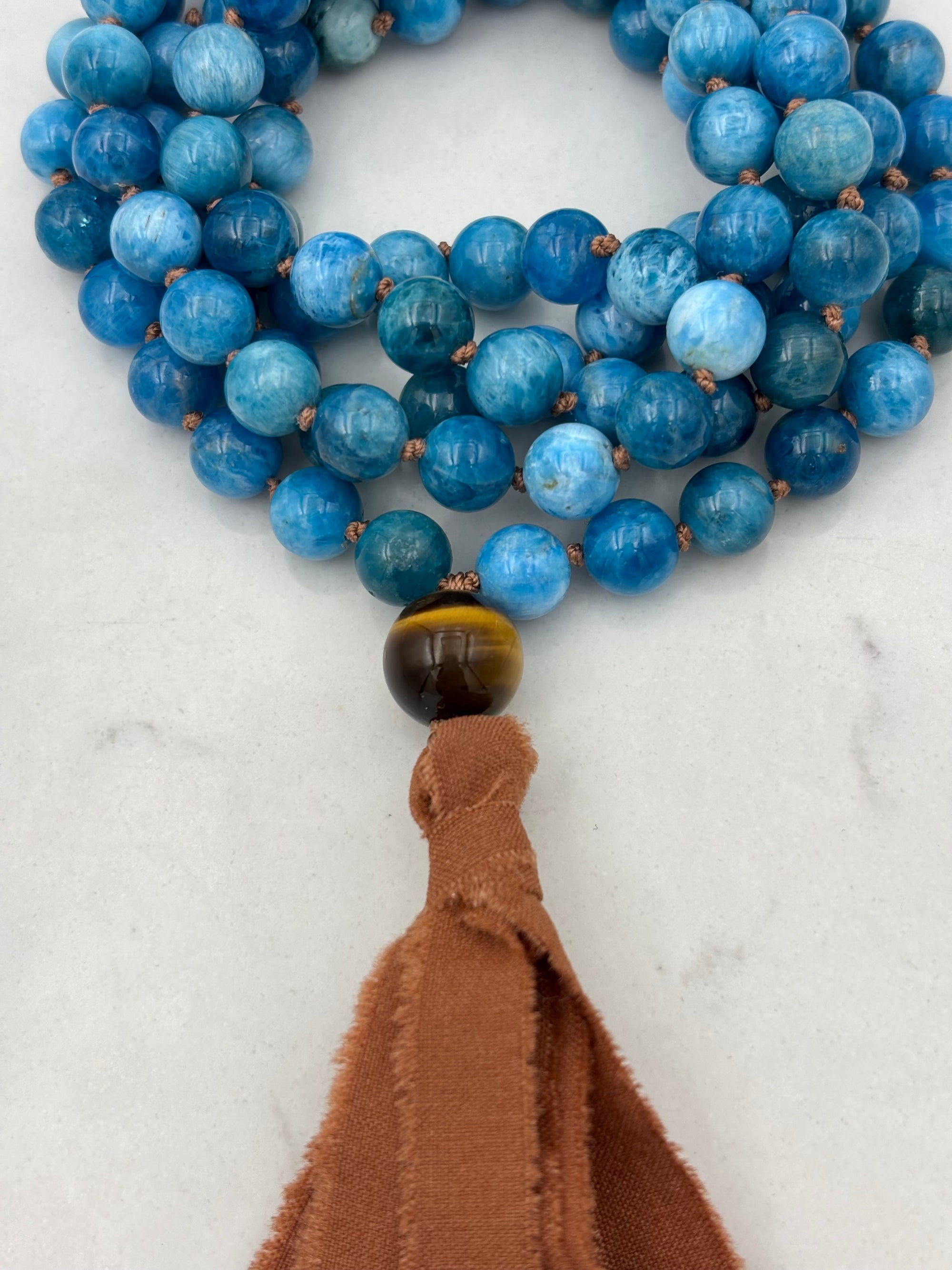 blue apatite gemstone mala with silk tassel | radiant malas | handmade in boulder, colorado