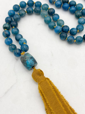 blue apatite gemstone mala with turquoise guru bead and ochre silk ribbon tassel | radiant malas | handmade in boulder, colorado