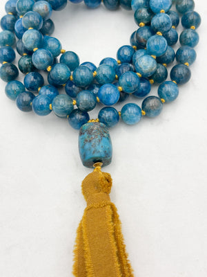 blue apatite gemstone mala with turquoise guru bead and ochre silk ribbon tassel | radiant malas | handmade in boulder, colorado