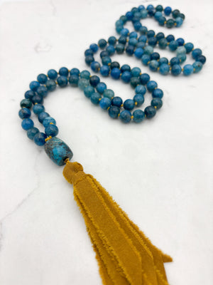 blue apatite gemstone mala with turquoise guru bead and ochre silk ribbon tassel | radiant malas | handmade in boulder, colorado