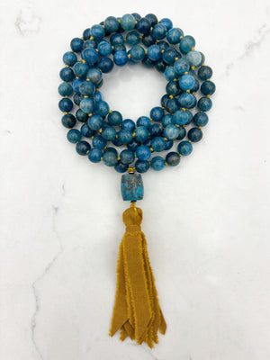 blue apatite gemstone mala with turquoise guru bead and ochre silk ribbon tassel | radiant malas | handmade in boulder, colorado