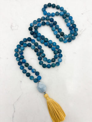 blue apatite gemstone mala with aquamarine guru bead and yellow tassel | radiant malas | handmade in boulder, colorado