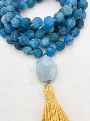 blue apatite gemstone mala with aquamarine guru bead and yellow tassel | radiant malas | handmade in boulder, colorado