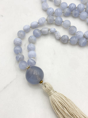blue chalcedony gemstone mala with chalcedony guru bead and cream colored tassel | radiant malas | handmade in boulder, colorado