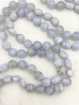 blue chalcedony gemstone mala with chalcedony guru bead and cream colored tassel | radiant malas | handmade in boulder, colorado