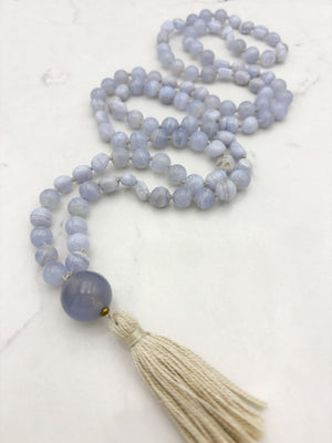 blue chalcedony gemstone mala with chalcedony guru bead and cream colored tassel | radiant malas | handmade in boulder, colorado