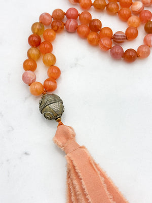 Red Botswana Agate Gemstone Mala with brass guru bead and peach silk tassel | radiant malas | handmade in Boulder, colorado