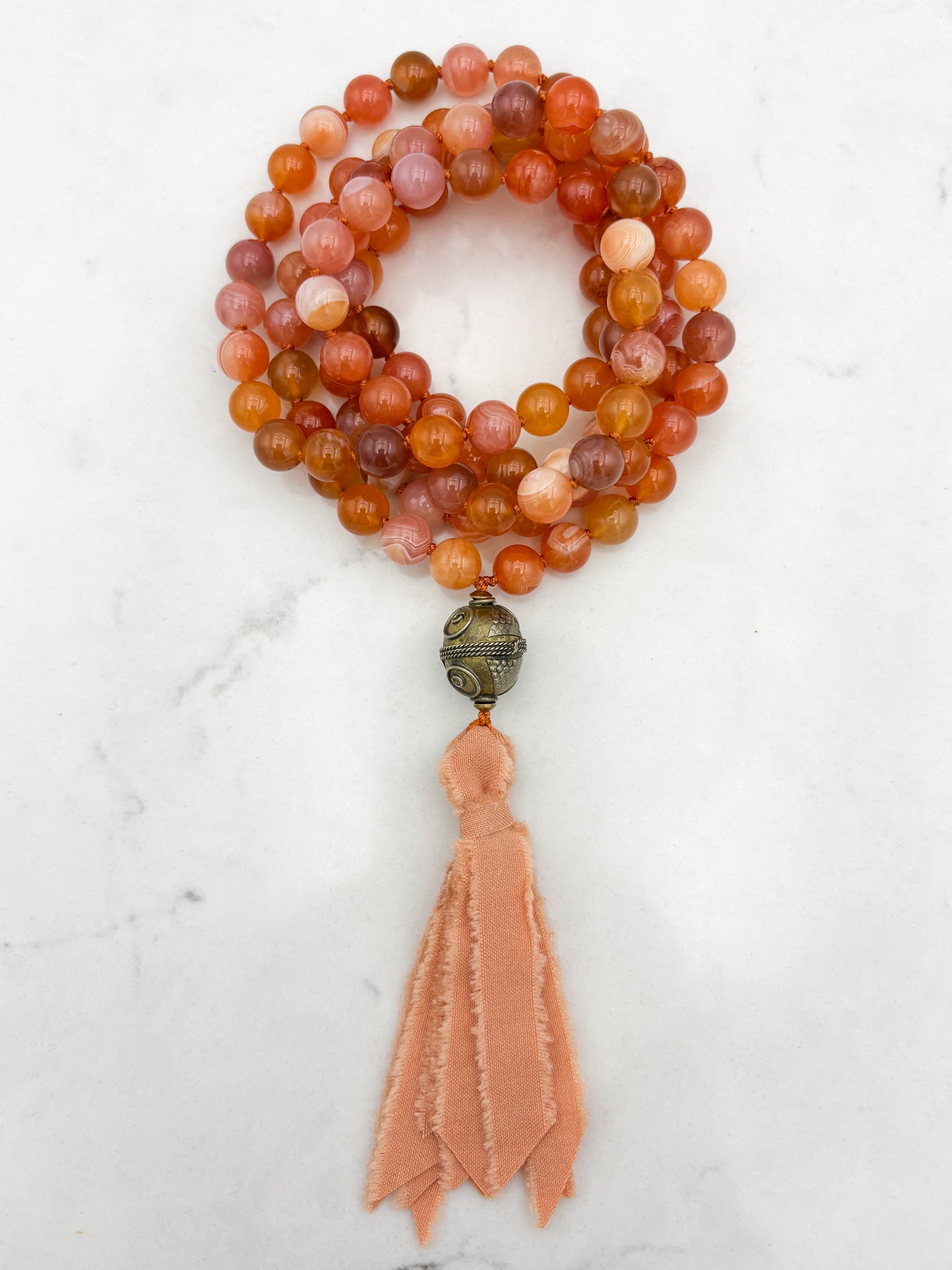 Red Botswana Agate Gemstone Mala with brass guru bead and peach silk tassel | radiant malas | handmade in Boulder, colorado