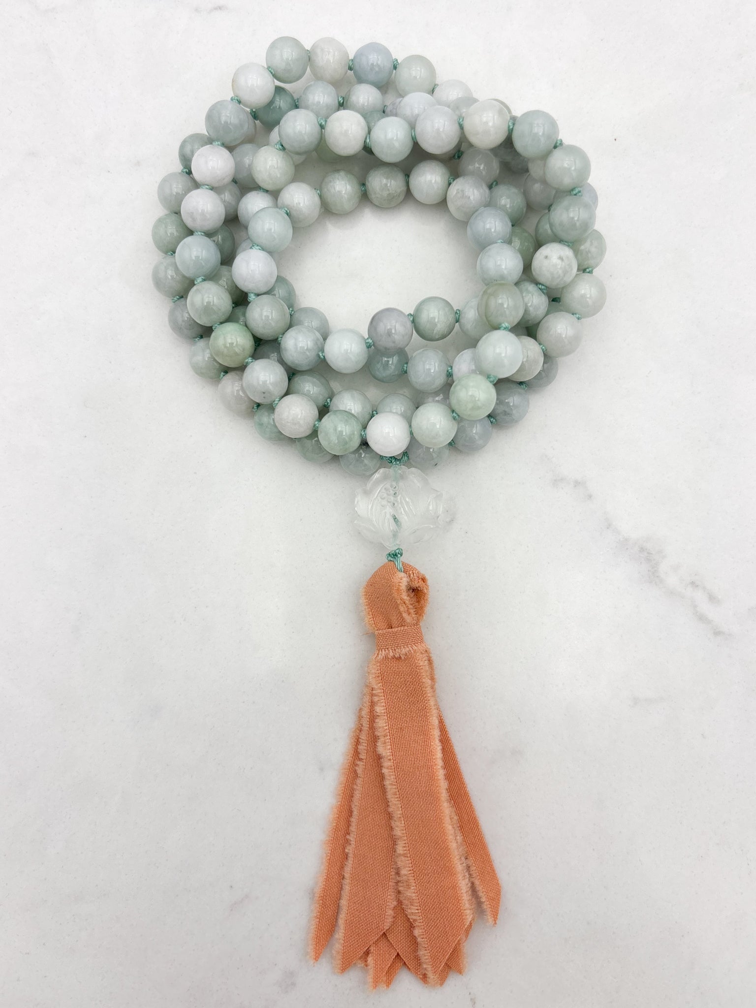 burma jade gemstone mala with clear quartz lotus guru bead and peach silk tassel | radiant malas | handmade in boulder, colorado