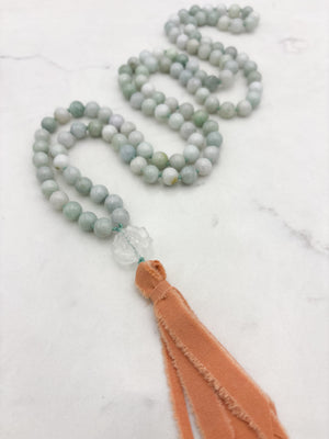 burma jade gemstone mala with clear quartz lotus guru bead and peach silk tassel | radiant malas | handmade in boulder, colorado