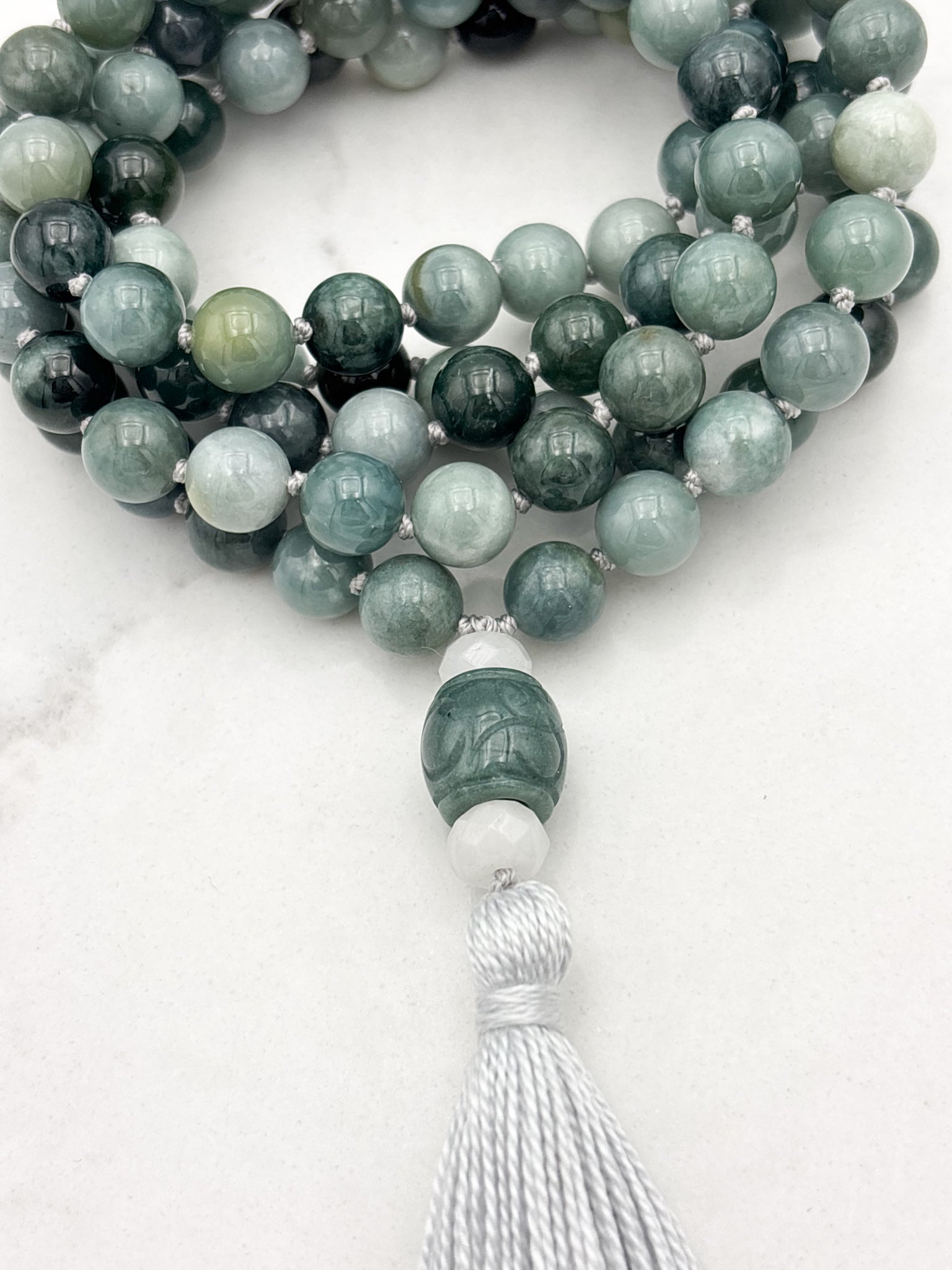 burma jade gemstone mala with white and green jade guru bead and gray tassel | radiant malas | handmade in boulder, colorado