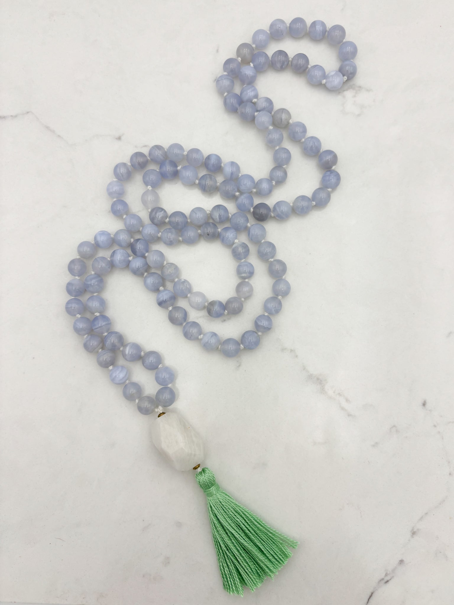 chalcedony gemstone mala with moonstone guru bead and green tassel | radiant malas | handmade in boulder, colorado