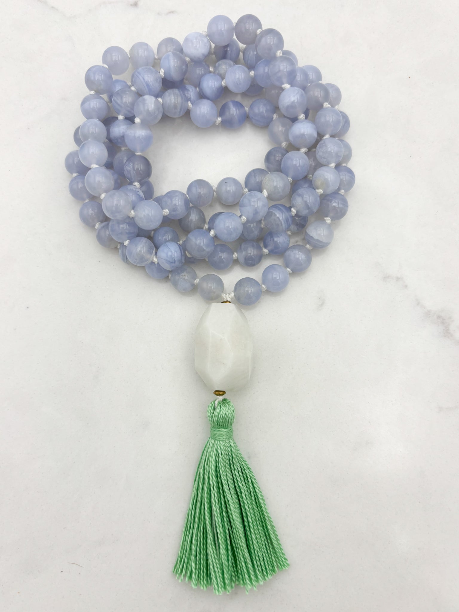 chalcedony gemstone mala with moonstone guru bead and green tassel | radiant malas | handmade in boulder, colorado