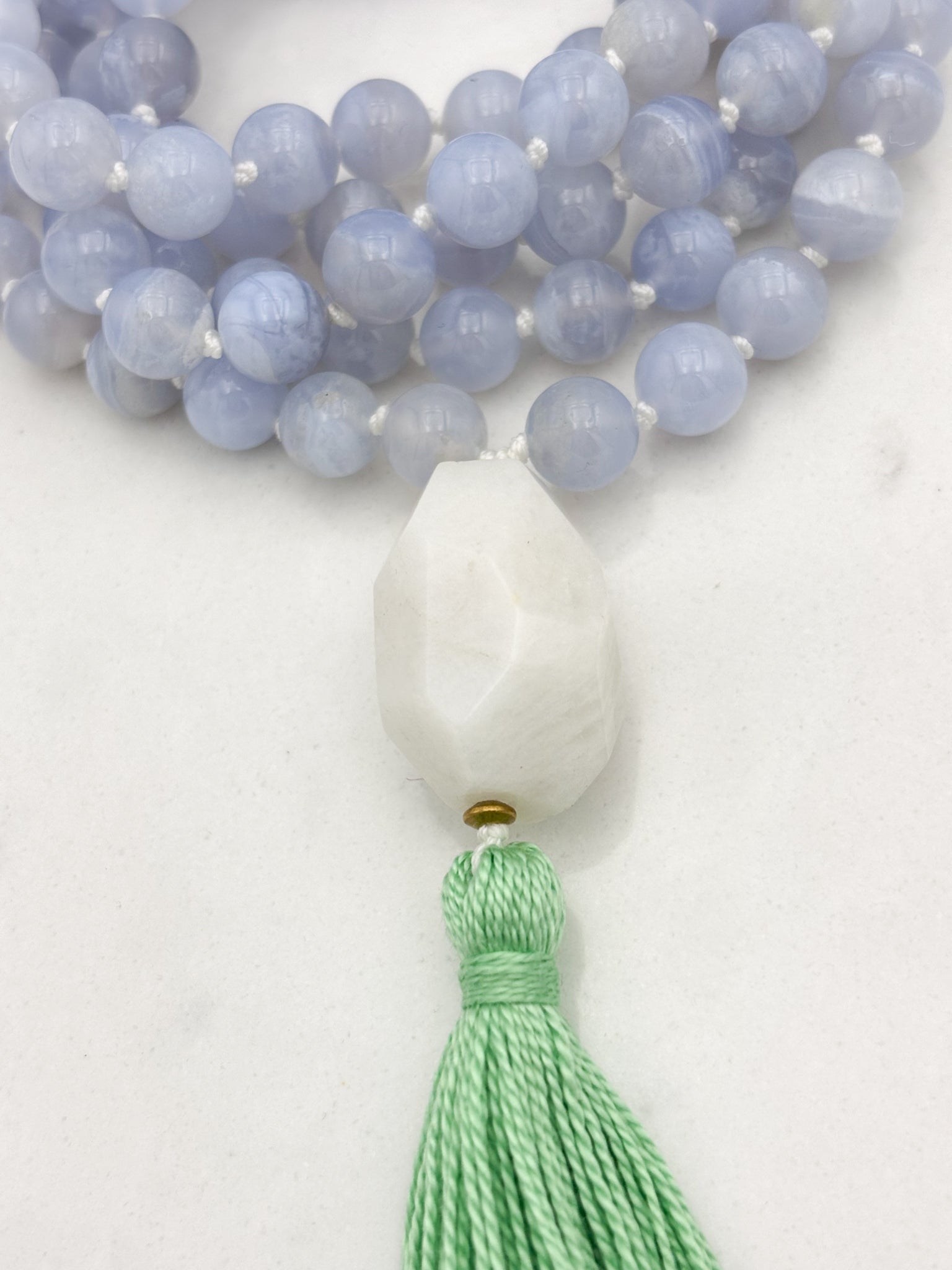 chalcedony gemstone mala with moonstone guru bead and green tassel | radiant malas | handmade in boulder, colorado