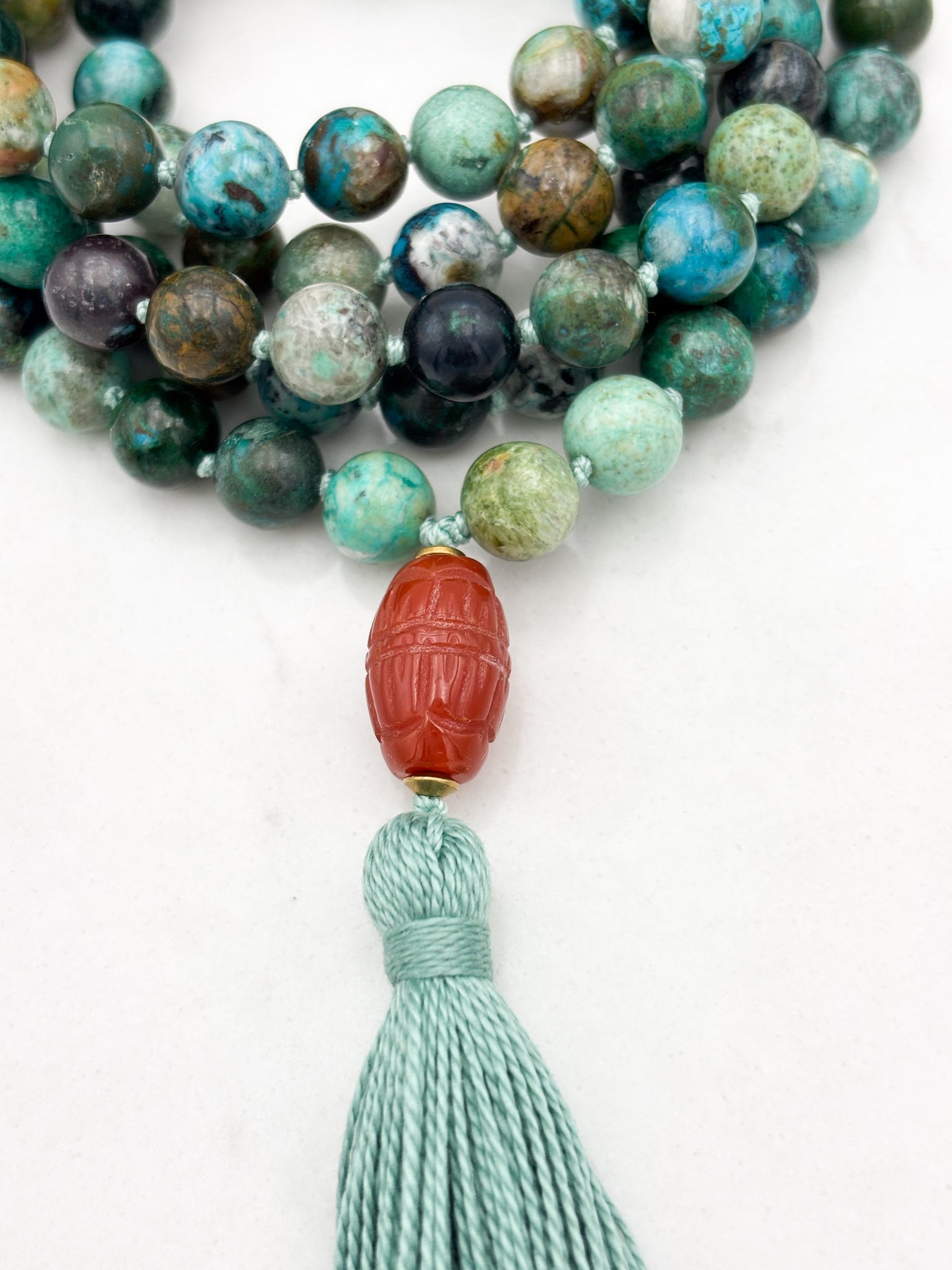 chrysocolla gemstone mala necklace  with carved carnelian guru bead and mint green tassel| radiant malas | handmade in boulder, colorado