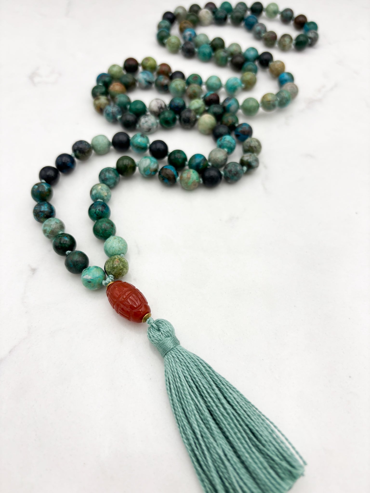 chrysocolla gemstone mala necklace  with carved carnelian guru bead and mint green tassel| radiant malas | handmade in boulder, colorado