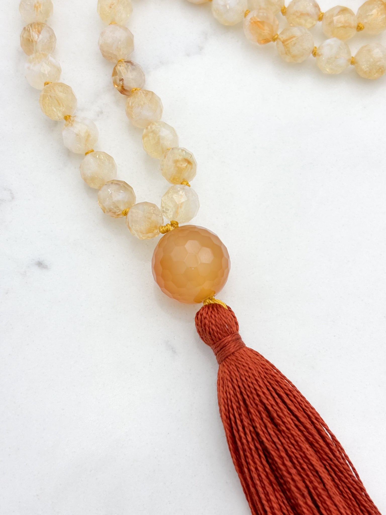 citrine gemstone mala necklace with faceted carnelian guru bead and rust tassel | radiant malas | handmade in boulder, colorado