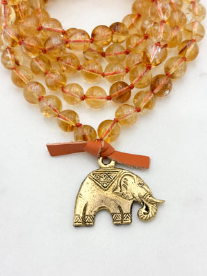 citrine gemstone mala necklace with brass elephant pendant | radiant malas | handmade in boulder, colorado