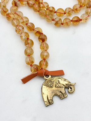 citrine gemstone mala necklace with brass elephant pendant | radiant malas | handmade in boulder, colorado