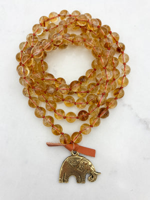 citrine gemstone mala necklace with brass elephant pendant | radiant malas | handmade in boulder, colorado