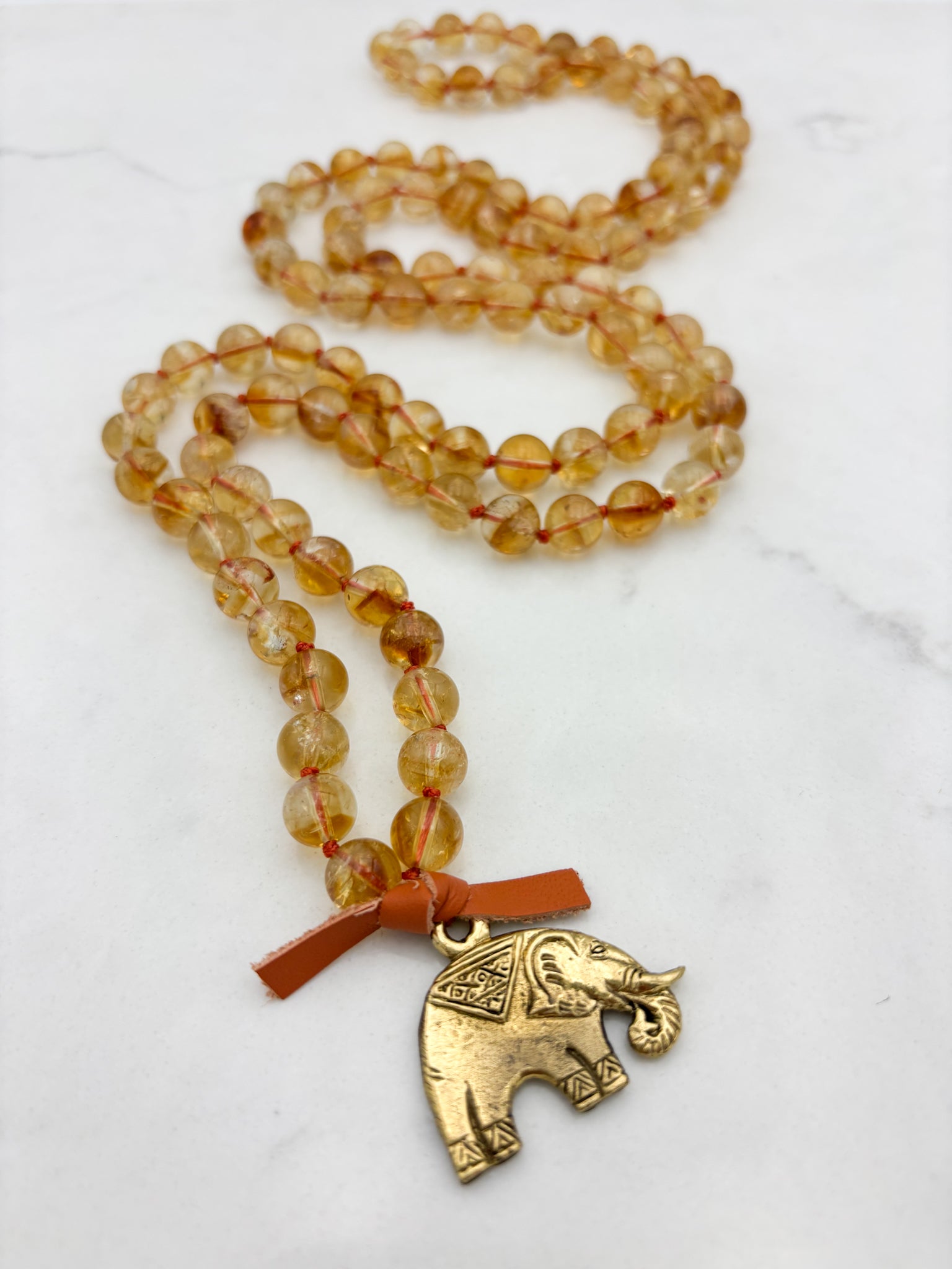 citrine gemstone mala necklace with brass elephant pendant | radiant malas | handmade in boulder, colorado