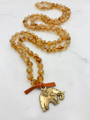 citrine gemstone mala necklace with brass elephant pendant | radiant malas | handmade in boulder, colorado