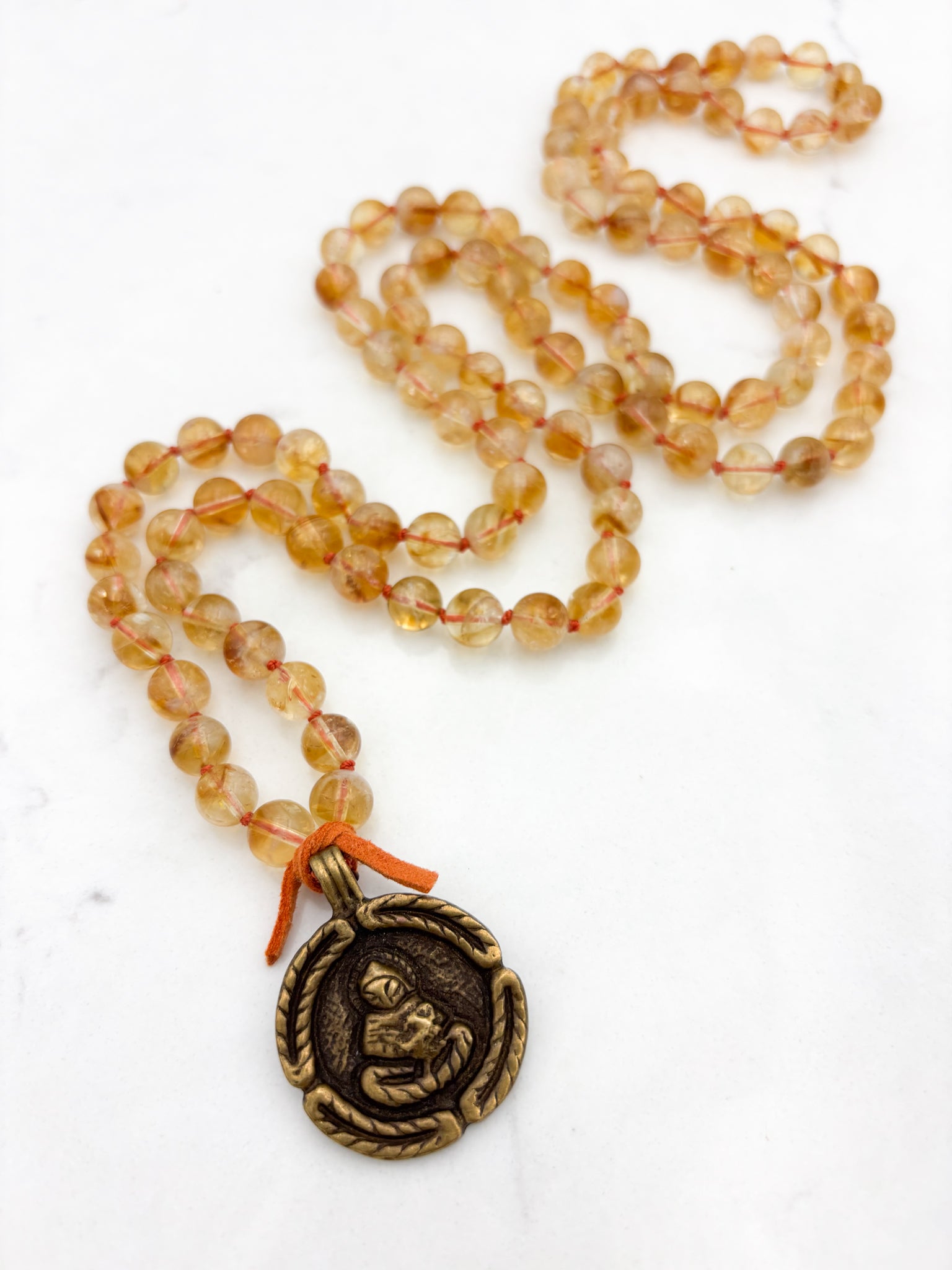 citrine gemstone mala necklace with round brass pendant | radiant malas | handmade in boulder, colorado